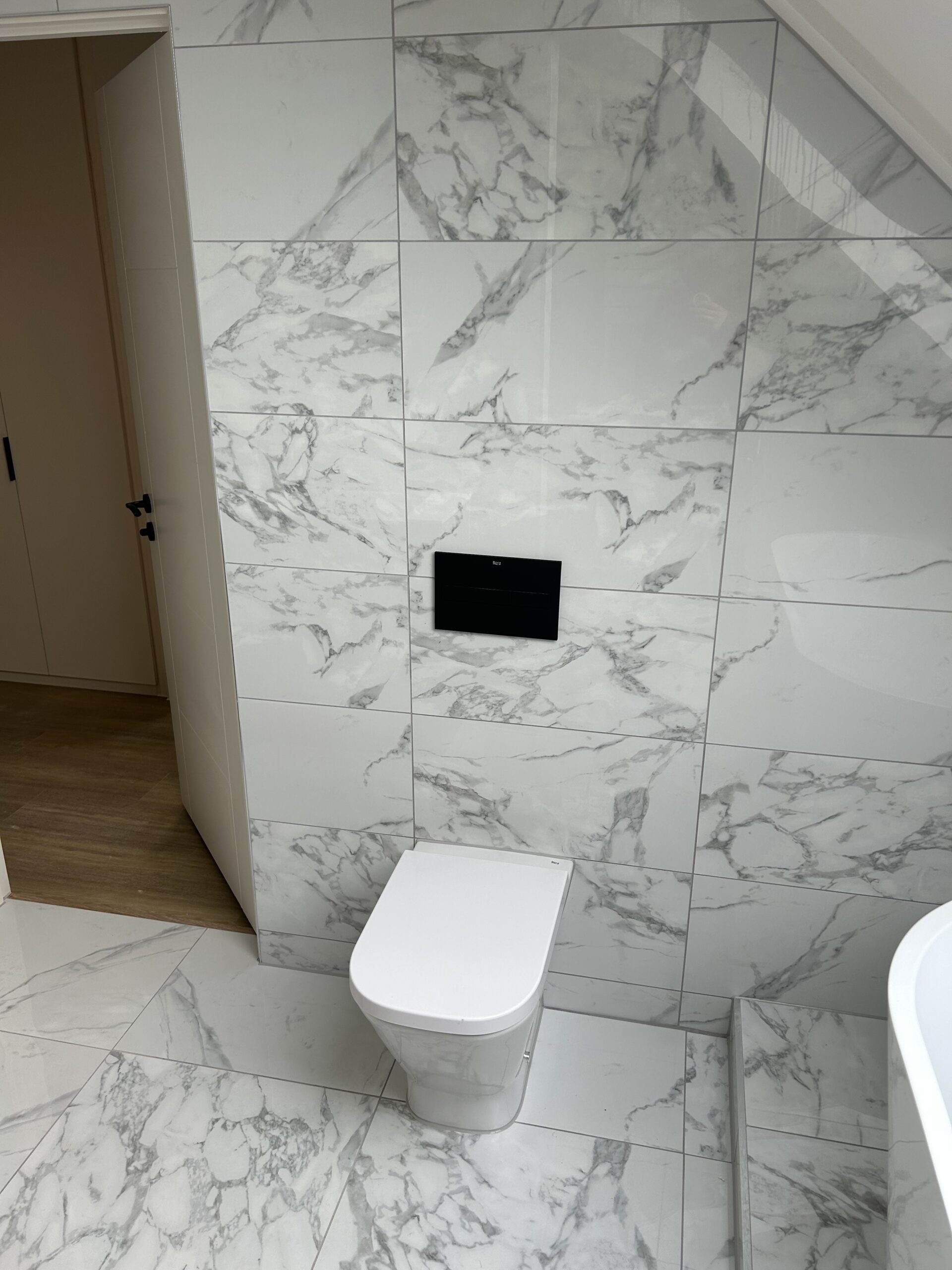 Toiler install with marble background at a home in Portsmouth - Portsmouth Plumbers